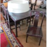An Oriental dining table and six chairs