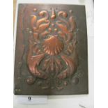 An Arts & Crafts beaten copper letter folder with raised design of shells, fish and seaweed to