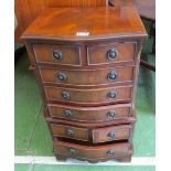 A small chest of various drawers