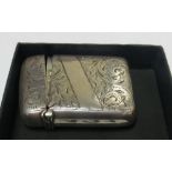 A silver vesta case with etched decoration