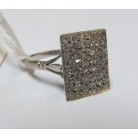 A rectangular ring made up of small diamonds marked platinum