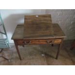 A 19th Century mahogany architects table with rising centre and drawer and dropflap at the back