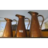 Three copper jugs