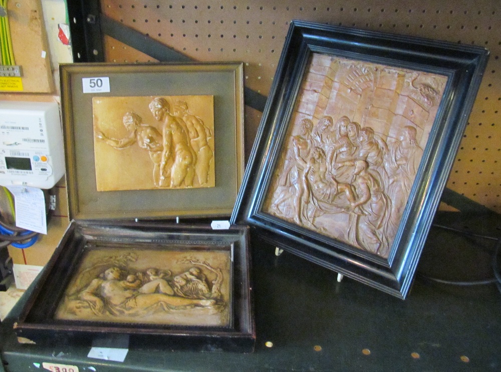 Three pottery plaques