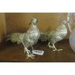 A pair of plated pheasant ornaments
