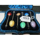A set of six bean terminal and enamel coffee spoons (s/a/f) boxed