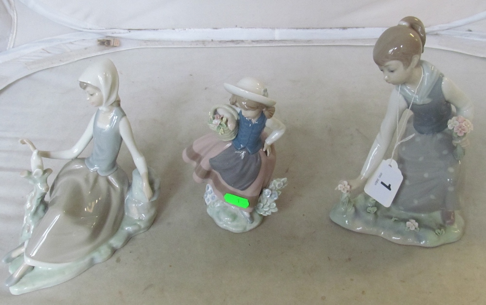 Three Lladro figures; girl with basket of flowers, lady picking flowers and lady with dove