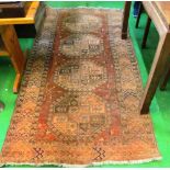 An iron red ground rug
