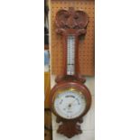 A Victorian oak cased barometer/thermometer