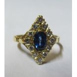 An 18ct gold sapphire and diamond lozenge shape ring