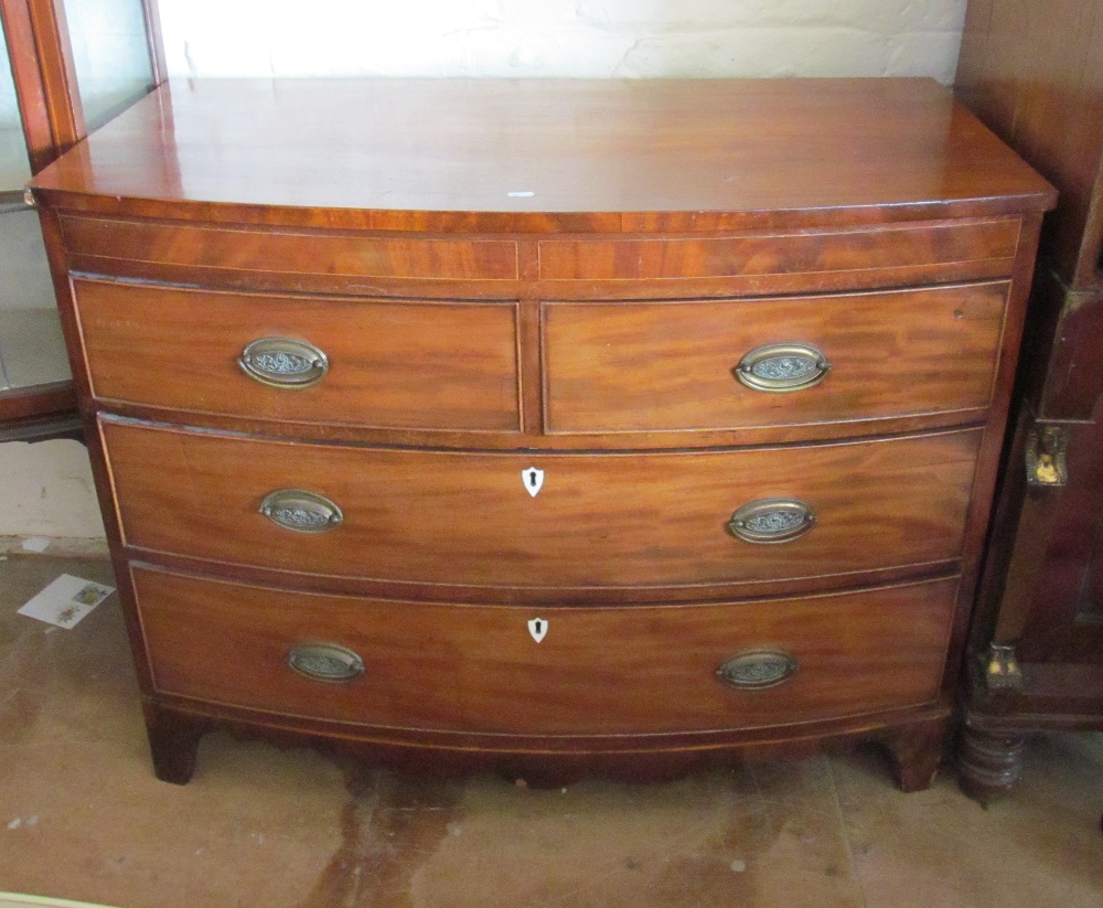 A small 19th Century bowfront chest of two short and two long drawers