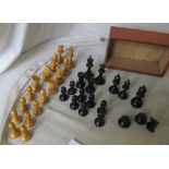 A chess set (one black missing knights head and an extra larger Bishop) and a backgammon box