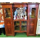 An Edwardian mahogany inlaid display cabinet with central mirror and two glazed lower doors,