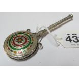 A white metal and enamel rattle