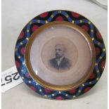 An enamelled brass late Victorian photo frame containing antique photo by Medringtons of Liverpool