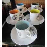 Some Susie Cooper five cups and saucers