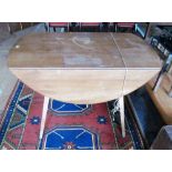 An Ercol dropleaf table