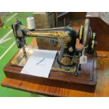 A Singer vintage hand sewing machine