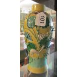 A yellow glazed Japanese vase with raised design of stork amongst lily pads hairline to rim