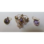 An Edwardian 9ct gold amethyst heart shape pendant and pair amethyst earrings