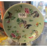 A Japanese celadon glazed plate decorated butterfly’s and flowers