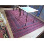 A Pakistani Belouch carpet red, blue and cream geometric design