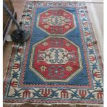 An Iranian Tabriz rug blue and red design on cream ground