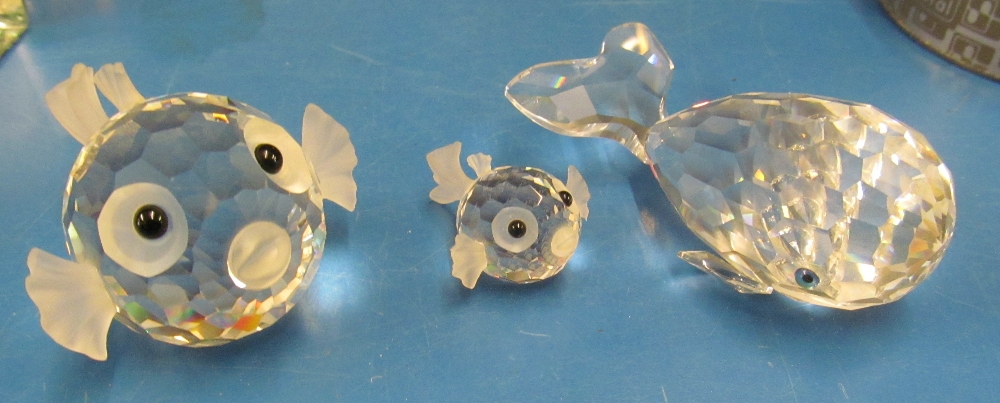 A Swarovski whale, blowfish and small blowfish