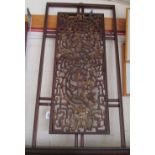 An oriental wall panel with decorative gilt centre