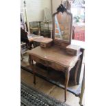 A small dressing table with mirror