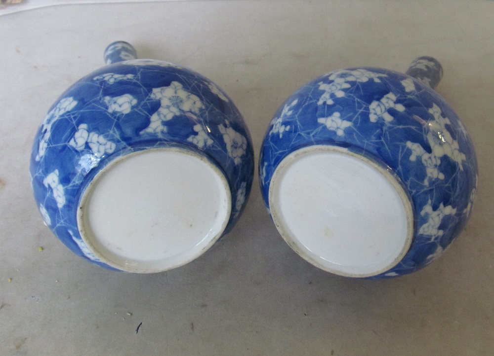 A pair of blue and white long necked vases floral design - Image 3 of 3