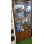An oriental display cabinet with cupboard under