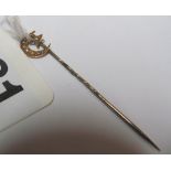 An 18ct gold and seed pearl moon and star stick pin