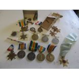 Various groups of medals and badges