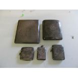 Three silver vestas and two silver cigarette cases