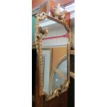 A 19th Century gilt framed mirror with cresting of two birds and leaves