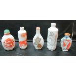 Five oriental scent bottles one with insect (cockroach?) and applied seal, one with figures, a