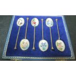A set of six silver and enamel bean terminal coffee spoon each one a different flower maker possibly