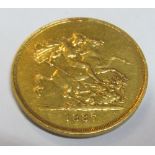 A gold Five Pound coin 1887