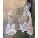Two Lladro figures boy telling dog to be quiet and boy with lamb