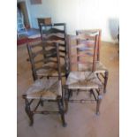 Four matched oak ladder back chairs on cabriole legs and turned stretchers, in need of re-rushing (