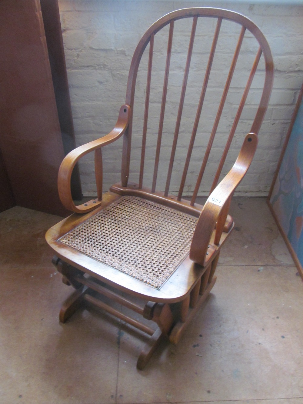 A cane seated rocking chair