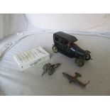 A tin plate vintage car 'Hessmobil 1024', Britains cannon, model plane and miniature cars (boxed)