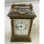 A brass cased carriage clock the face inscribed P Orr and Sons Madras and Rangoon