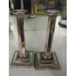 A pair of Sheffield plated candlesticks