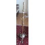 A brass floor lamp