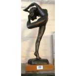 A modern resin filled bronze effect figure of nude lady dancing