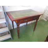 An Edwardian leather top table with drawer