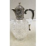 A silver mounted cut glass claret jug (chipped)