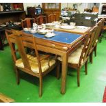 A large rosewood table 100"x43" and eight chairs